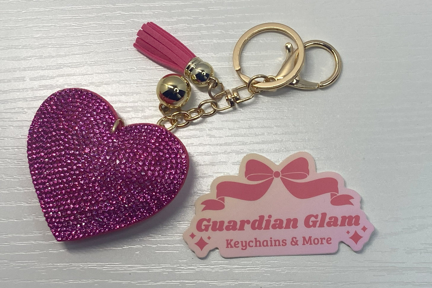 Dark Pink Heart-shaped rhinestone
Gold keychain with tassel