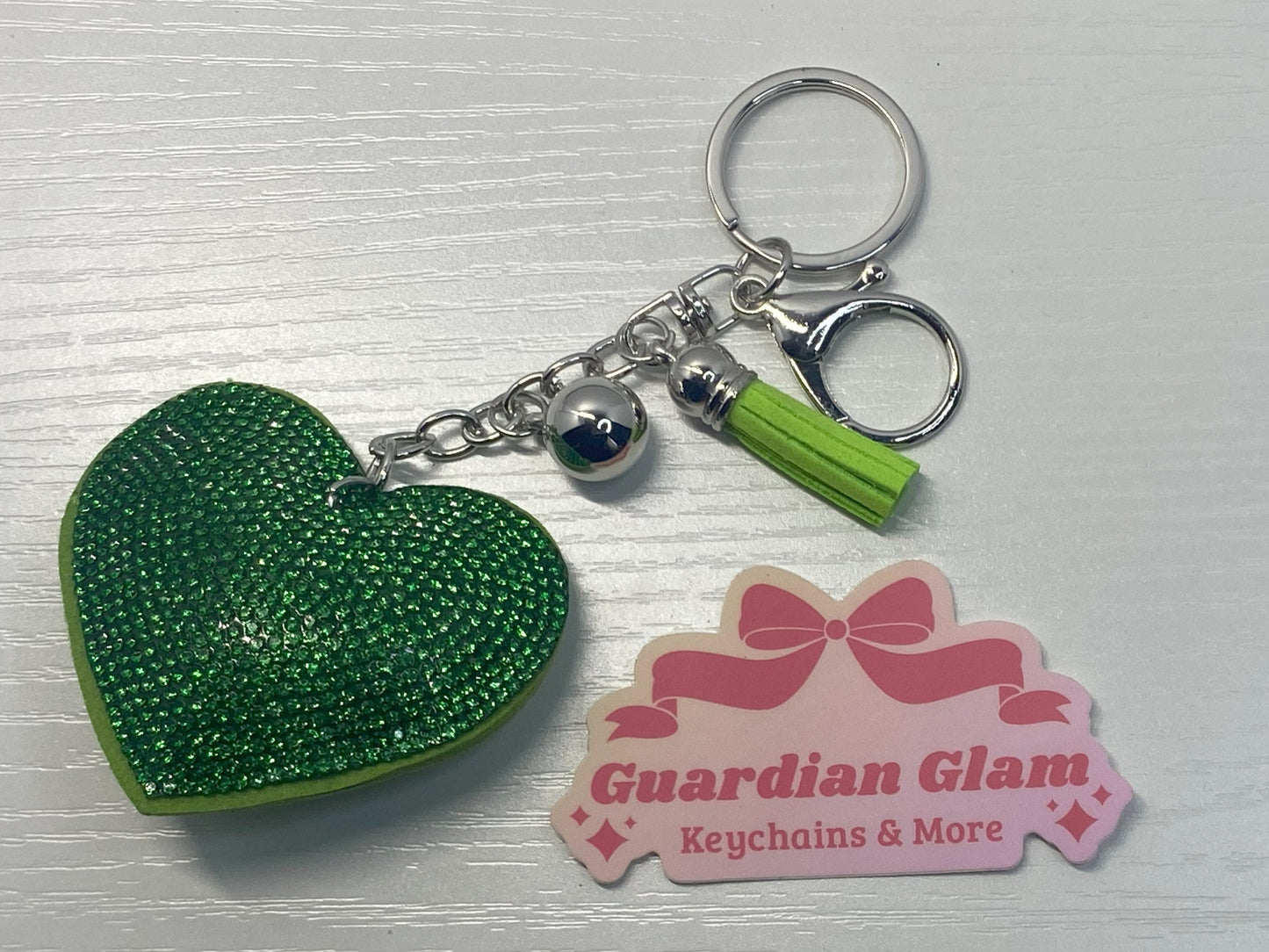 Green Heart-shaped rhinestone
Sliver keychain with tassel